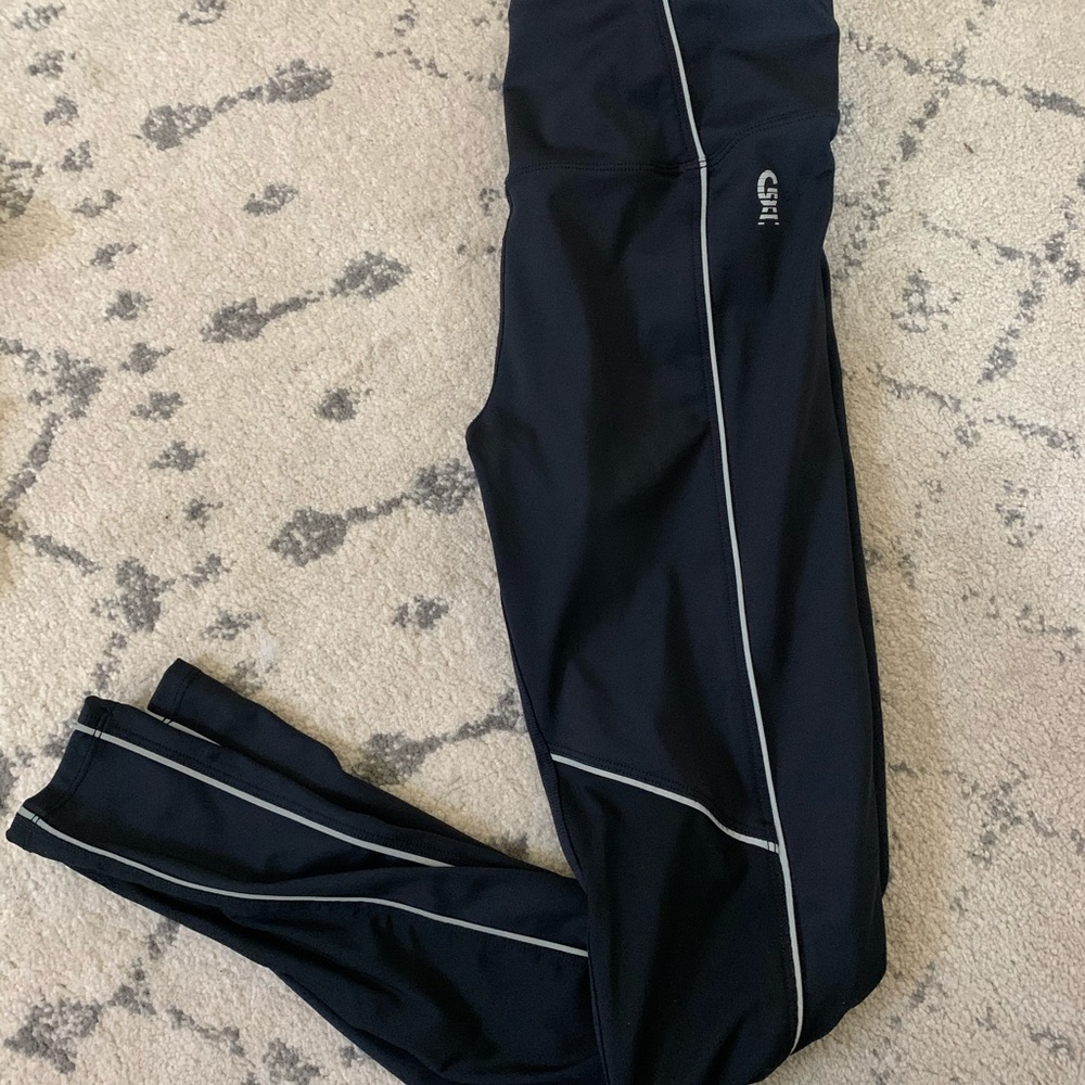 Good American black reflective and mesh legging